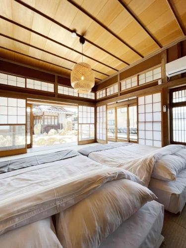 a large room with two large beds in it at b local Hayase House - Vacation Villa facing ocean view with BBQ Grill Free Parking Space in Kure