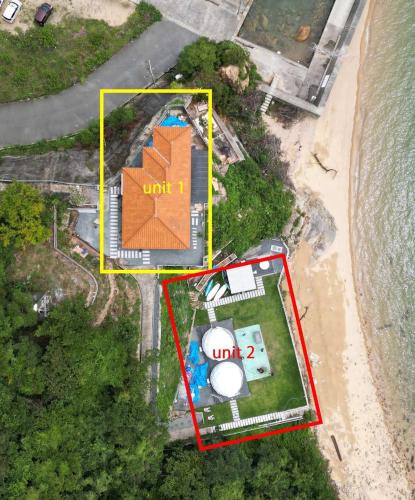an aerial view of a house on the beach at bLOCAL Sugawa House - Exclusive Seaside Escape in Ocean House in Kure