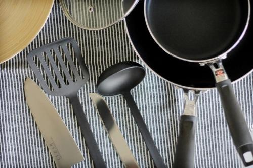 a group of kitchen utensils sitting on a table at bHOTEL Nagomi - Beautiful 2BR Apt City Center for 10 Ppl in Hiroshima