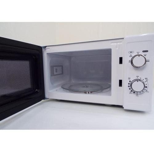 a white microwave oven sitting on top of a shelf at bHOTEL Nagomi - Large 2BR Apt City Center for 10 Ppl in Ōsukachō