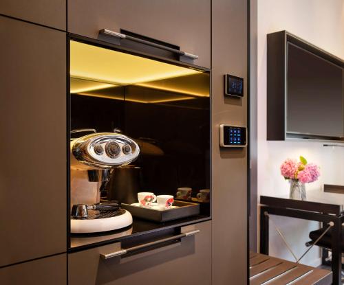 a bathroom with a sink and a mirror at art'otel Rome Piazza Sallustio, Powered by Radisson Hotels in Rome