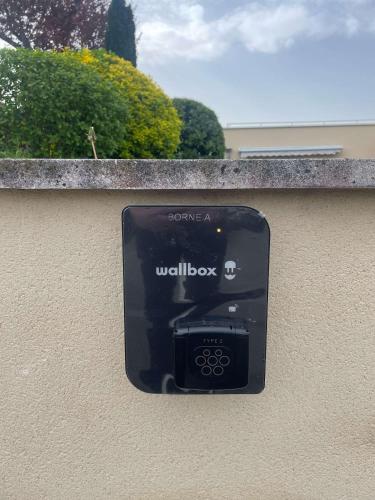 a black box on the side of a wall at La Bonbonniere - Sure Hotel Collection by Best Western in Talant