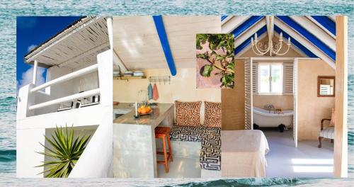 a house with a kitchen and a bath tub in the water at Die Opstal house with Apartments in Paternoster
