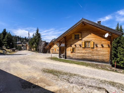 a log cabin on the side of a road at 1A Chalet Enzianhuette - Wandern und Indoor Sauna in Elsenbrunn