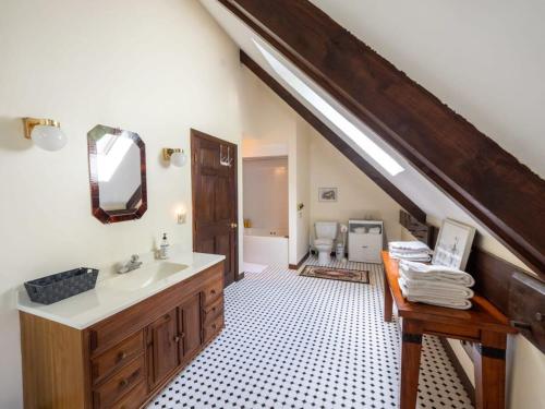 een badkamer met een wastafel en een toilet. bij Berkshire Vacation Rentals: Pristine Home In Becket Woods in Becket