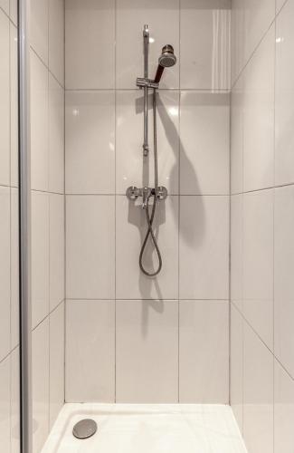 a bathroom with a shower with a glass door at Espaces Gîtes in Sainte-Escobille