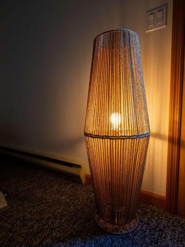 a lamp sitting on the floor in a room at Private Berkshires Home On 5+ Acres Rustic & Chic in Otis