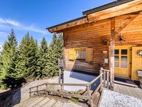 a log cabin with a porch and a wooden deck at 1A Chalet Enzianhuette - Wandern und Indoor Sauna in Elsenbrunn