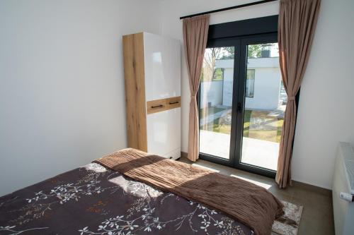 Ένα ή περισσότερα κρεβάτια σε δωμάτιο στο Drina Lux