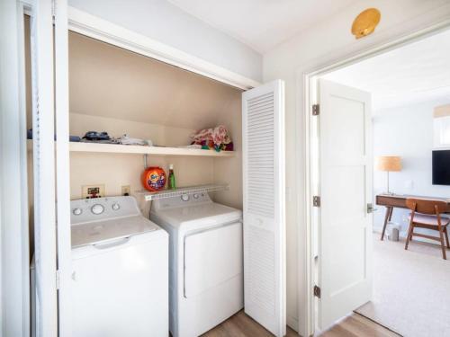 a laundry room with a washer and dryer at Tranquil Views On Planting Island Cove in Marion