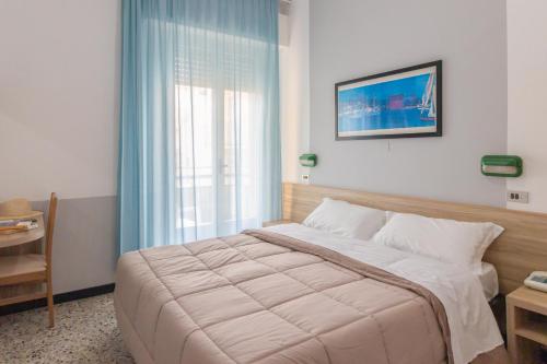 Postel nebo postele na pokoji v ubytování Abc Hotel