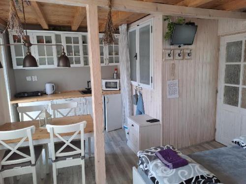 a small kitchen with a table and a kitchen with a counter at NAD STARÝM SKLEPEM in Valtice