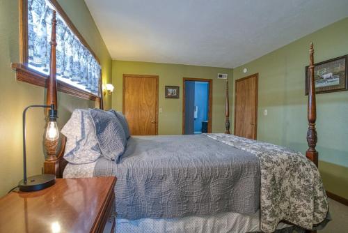 a bedroom with a bed and a table and a window at Fairhaven in Leadville