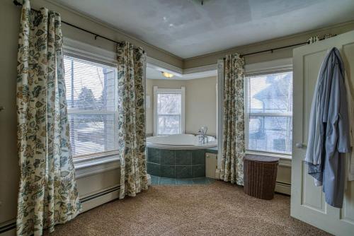 a bathroom with a tub and a window at The Ice Palace in Leadville