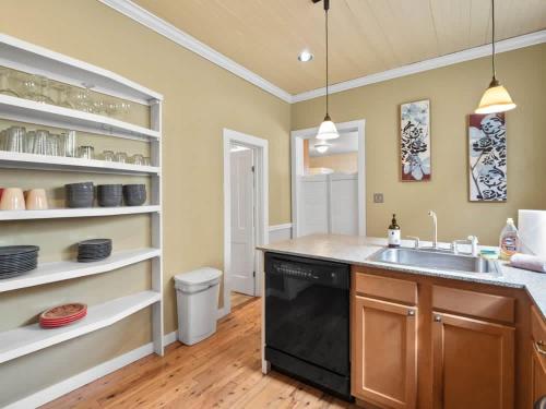 a kitchen with a sink and a dishwasher at The Zinnia Victorian Charm with Mountain Views in Leadville