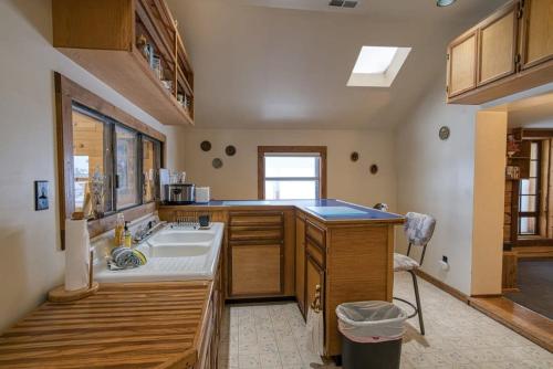 a large kitchen with a sink and a counter at The Rose in Leadville