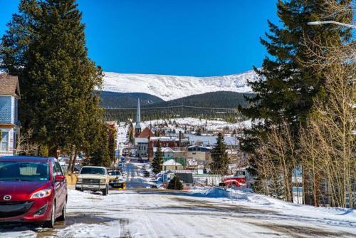 a street in a town with a snow covered mountain at Rosemont in Leadville