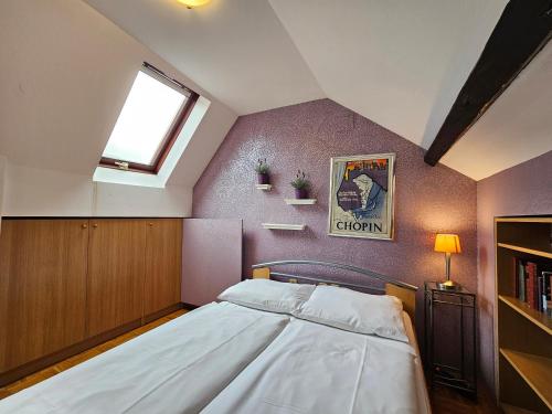 a bedroom with a large bed in a attic at Apartment Nina with private terrace Tour As Ljubljana in Ljubljana
