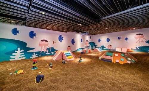 a room with a mural of a room with tents at Grand Bay Resort Hotel in Hengchun