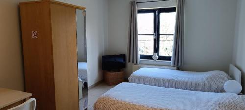 Ein Bett oder Betten in einem Zimmer der Unterkunft 1 2 (Want To) Stay - Furnished business apartments