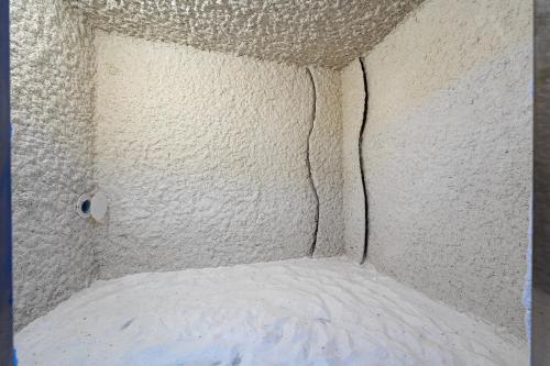 a corner of a room with a wall covered in snow at Hotel De‘Andros Virpazar in Virpazar