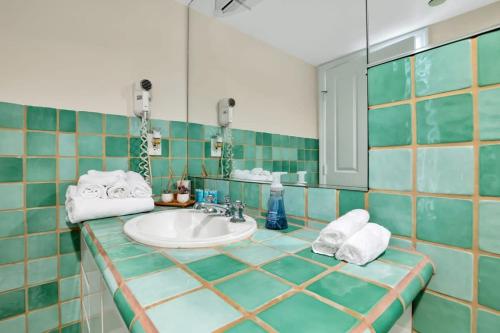 a bathroom with a sink and a mirror at NEW Amazing large 3BR direct oceanfront Penthouse On Ocean Drive!! in Miami Beach