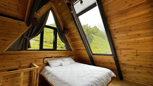 Postel nebo postele na pokoji v ubytování paradise valley bungalow