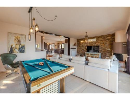a living room with a pool table at Casa Natura in Psalidi