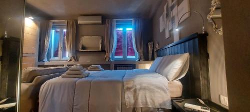 a bedroom with two beds and a blue light at Gondola Azzurra in Civitanova Marche
