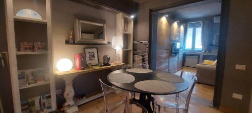 a small kitchen with a table in a room at Gondola Azzurra in Civitanova Marche