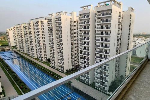 a view of large apartment buildings from a balcony at New 1BHK at Central Park, Sohna Road, Ayaansh Resort in Gurgaon