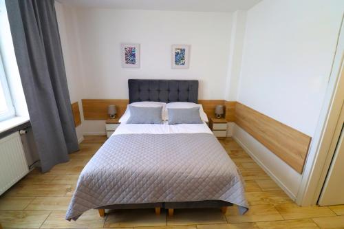 Postel nebo postele na pokoji v ubytování Skarbek Iława, pokoje i apartamenty