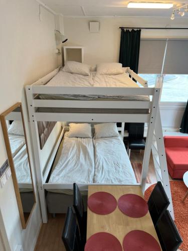 a bedroom with two bunk beds in a room at Central, university - centralt, högskolan in Halmstad