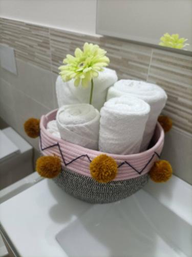 a bunch of towels in a basket in a bathroom at Il Tarassaco-exclusive pool in Santa Maria a Monte