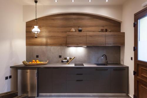 a kitchen with a sink and a counter top at Utopia Luxury Suites - Old Town in Rhodes Town