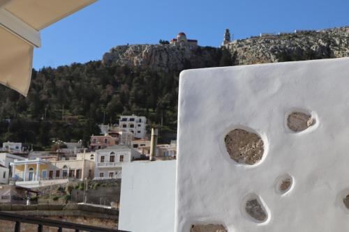 a view of the town from the balcony of a house at FOTEINI RESIDENCE in Kalymnos