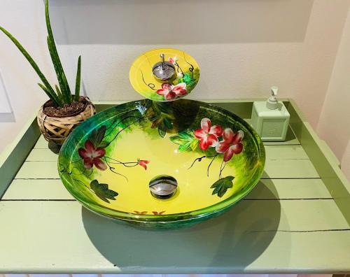 two bowls on a table with flowers on it at Skrattande Ko in Tingsryd