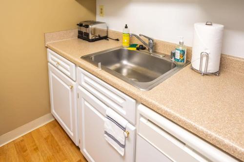 a kitchen counter with a sink and a toaster at 2BR Premium A-Location Apartment in Arlington