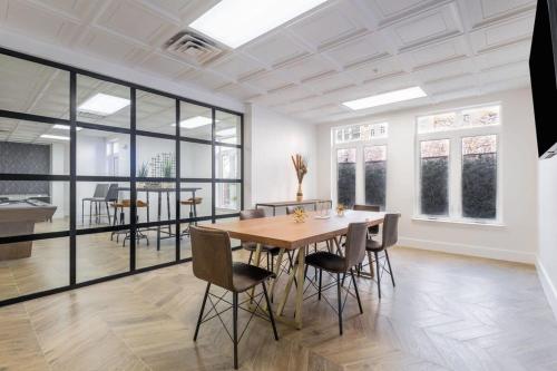 a dining room with a table and chairs at 3BR Premium Downtown Apartment with Office & Gym in Charlotte