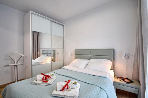 Säng eller sängar i ett rum på Piękny Apartament Balticus SeaView by Rent like home