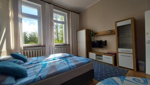 Säng eller sängar i ett rum på Apartament Wanta II Kołobrzeg