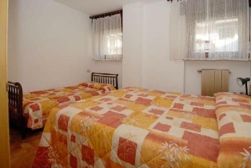 Postel nebo postele na pokoji v ubytování CASA PINUCCIA APPARTAMENTO EST