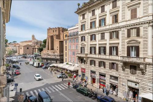 a view of a city street with cars and buildings at Fori Imperiali Luxe Mansion in Rome