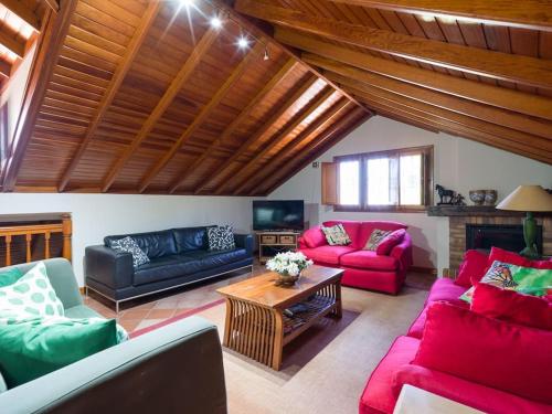 a living room with two couches and a table at Villa with Pool and sea views in Banana Plantation in Arucas