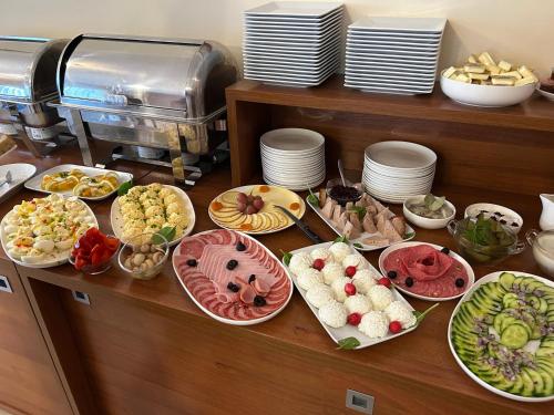 a buffet with many different types of food on a table at Pod Bukami - Chill&SPA in Szklarska Poręba