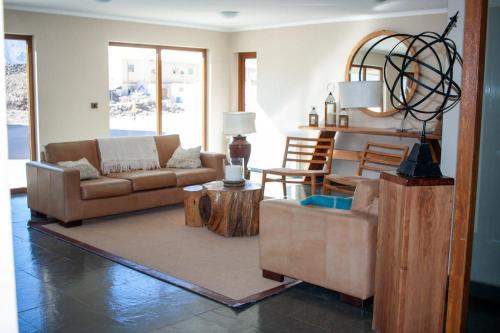 a living room with two couches and a table at HOM I 6PAX Ski-Out en Valle Nevado Edif El Plomo EP607 in Farellones