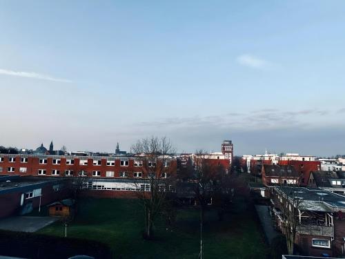 a view of a city with buildings and trees at FeWo Am Povelturm Aufzug & Loggia in Nordhorn