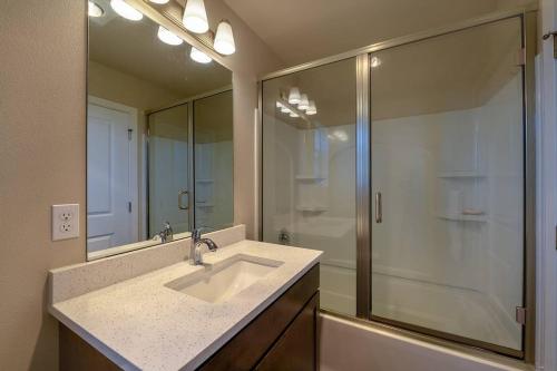 a bathroom with a sink and a shower at A-Seattle Urban Village- Lopez- Roof top view deck in Seattle