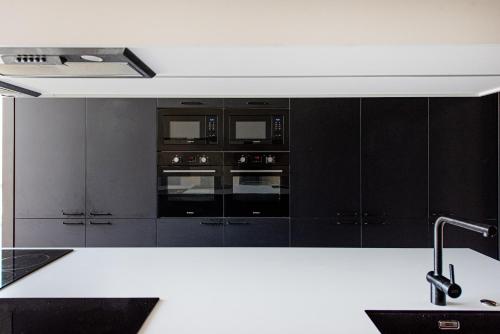 Dapur atau dapur kecil di SHED Vilnius Coliving
