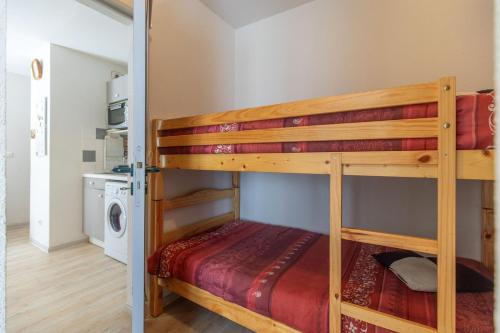 a couple of bunk beds in a room at BB19 - T2 avec garage privé à Barèges in Barèges